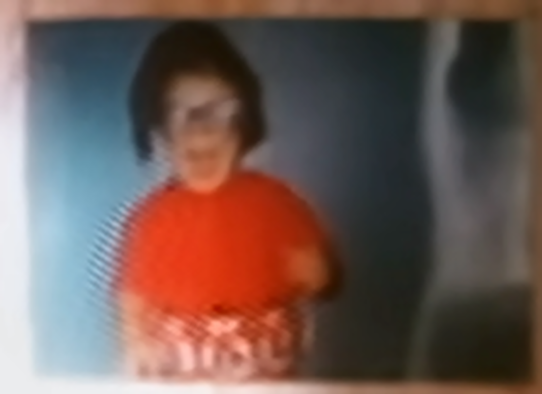 Child in red — framed photo — enhanced image
